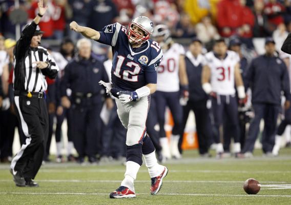 Patriots quarterback Tom Brady is pumped up after his run for a first down in the fourth quarter. Brady threw four touchdowns for 296 yards in a 42-14 rout of the Texans drawing chants of MVP from the Gillette Stadium crowd. (Credit: Associated Press)